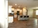 Open kitchen boasts an island, stainless appliances, and granite countertops at 8890 Sw 104Th Cir, Ocala, FL 34481