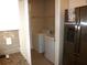 Laundry room with a washer, dryer and convenient access from the kitchen at 8890 Sw 104Th Cir, Ocala, FL 34481