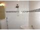 Close-up of tile shower featuring a shower head and a tiled shower seat at 8890 Sw 104Th Cir, Ocala, FL 34481