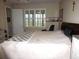 Cozy bedroom featuring a bed, window with shutters, and a calming decor at 8890 Sw 104Th Cir, Ocala, FL 34481