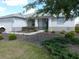Beautiful home featuring manicured landscaping, walkway, and covered front porch at 8890 Sw 104Th Cir, Ocala, FL 34481