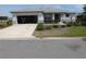 Charming single-story home with a well-manicured front yard and an open garage at 8890 Sw 104Th Cir, Ocala, FL 34481