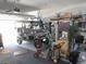 Spacious garage featuring a golf cart and ample room for storage and organization of your vehicle and tools at 8890 Sw 104Th Cir, Ocala, FL 34481