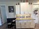 Bright and functional kitchen area with granite countertops and white cabinetry at 8890 Sw 104Th Cir, Ocala, FL 34481