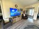 Inviting living room with contemporary decor, including a large TV and comfortable seating at 8890 Sw 104Th Cir, Ocala, FL 34481