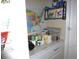Pantry with granite counters, a sink, plenty of storage, and wood-look floors at 8890 Sw 104Th Cir, Ocala, FL 34481