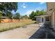 Spacious backyard with a concrete patio and a well-maintained lawn surrounded by a wooden fence at 4012 Shorecrest Dr, Orlando, FL 32804