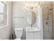 Bathroom with a modern vanity, a shower with new fixtures, and a stylish oval mirror at 4012 Shorecrest Dr, Orlando, FL 32804