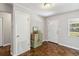 Foyer with wood floors, vintage cabinet, and front door at 4012 Shorecrest Dr, Orlando, FL 32804