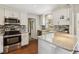 Updated kitchen with stainless steel appliances, granite countertops, and stylish backsplash at 4012 Shorecrest Dr, Orlando, FL 32804