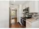Well-appointed kitchen featuring granite countertops, stainless appliances, and ample cabinetry at 4012 Shorecrest Dr, Orlando, FL 32804