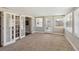 Bright living room with plush carpeting, French doors, and large windows for lots of natural light at 4012 Shorecrest Dr, Orlando, FL 32804