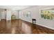 Open living room with hardwood floors, lots of light, and view of the front door at 4012 Shorecrest Dr, Orlando, FL 32804