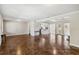 Open living room with hardwood floors and views into the modern kitchen at 4012 Shorecrest Dr, Orlando, FL 32804