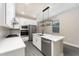 Modern kitchen featuring an island with a sink, stainless steel appliances, and ample cabinet space at 7672 Somersworth Dr, Kissimmee, FL 34747
