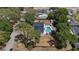 Aerial view of the property showcasing the home, pool, surrounding trees, and neighborhood at 1352 Charlotte St, Altamonte Springs, FL 32701