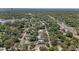 Overhead view of a leafy neighborhood showcasing homes with pools and verdant landscaping at 1352 Charlotte St, Altamonte Springs, FL 32701