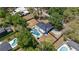 Aerial view of a home with a private pool, fenced yard, and lush landscaping, in a quiet neighborhood at 1352 Charlotte St, Altamonte Springs, FL 32701
