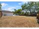Spacious backyard featuring a pool, privacy fence, and lush greenery, offering a private outdoor retreat at 1352 Charlotte St, Altamonte Springs, FL 32701