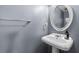 Bathroom featuring a sleek pedestal sink with an oval mirror at 1352 Charlotte St, Altamonte Springs, FL 32701