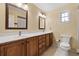 Classic bathroom features a dual sink vanity with wood cabinets and tile floors at 1352 Charlotte St, Altamonte Springs, FL 32701
