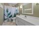 Bathroom featuring a single sink vanity and tile shower at 1352 Charlotte St, Altamonte Springs, FL 32701