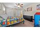 Bright bedroom features a ceiling fan, carpet, natural light and vibrant decor at 1352 Charlotte St, Altamonte Springs, FL 32701