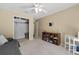 Neutral bedroom featuring a ceiling fan, carpet, a closet and a light-filled window at 1352 Charlotte St, Altamonte Springs, FL 32701