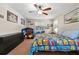 Bright bedroom features a ceiling fan, carpet, natural light and vibrant decor at 1352 Charlotte St, Altamonte Springs, FL 32701