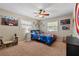 Fun bedroom features great natural light, ceiling fan, carpet and fun decor at 1352 Charlotte St, Altamonte Springs, FL 32701