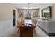Dining room includes wood table and chairs, a modern cabinet, and natural light at 1352 Charlotte St, Altamonte Springs, FL 32701
