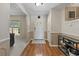 Inviting entryway features wood floors, and trim and leads into a brightly lit living space at 1352 Charlotte St, Altamonte Springs, FL 32701