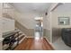 Inviting foyer with hardwood floors, staircase, and a glimpse into the kitchen, creating a warm and welcoming entrance at 1352 Charlotte St, Altamonte Springs, FL 32701
