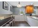 Eat-in kitchen boasts a long table and adjacent cabinets with granite countertops at 1352 Charlotte St, Altamonte Springs, FL 32701