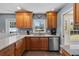 Charming kitchen boasts stainless steel appliances, granite counters and natural light from the window at 1352 Charlotte St, Altamonte Springs, FL 32701