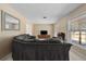 Inviting living room with a gray sectional sofa, recliner, media cabinet, and ample natural light at 1352 Charlotte St, Altamonte Springs, FL 32701