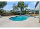 Sparkling pool surrounded by lounge chairs and umbrellas, creating a perfect backyard retreat at 1352 Charlotte St, Altamonte Springs, FL 32701