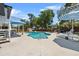 Inviting backyard pool with lounge chairs and umbrellas, ideal for relaxation and outdoor enjoyment at 1352 Charlotte St, Altamonte Springs, FL 32701
