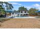 Lovely backyard featuring a private pool, sun loungers, and a covered patio for outdoor enjoyment at 1352 Charlotte St, Altamonte Springs, FL 32701