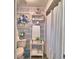 Stylishly wallpapered bathroom complete with shower and toiletry storage space at 53 Paine Dr, Winter Haven, FL 33884