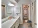 Well lit bathroom boasts long vanity countertop, large mirror, and is ready for your decor at 53 Paine Dr, Winter Haven, FL 33884
