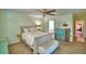 Comfortable bedroom with a ceiling fan, dresser and bench create a relaxing and inviting atmosphere at 53 Paine Dr, Winter Haven, FL 33884