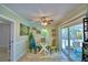 Cozy breakfast nook featuring a glass table, colorful chairs, and natural light at 53 Paine Dr, Winter Haven, FL 33884