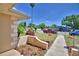 Charming curb appeal with detailed architectural elements, colorful plants, and meticulous landscaping at 53 Paine Dr, Winter Haven, FL 33884