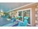 Extended lanai with views of the pool and outdoor seating areas at 53 Paine Dr, Winter Haven, FL 33884