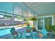 Relaxing lanai with cozy chairs, offering a peaceful outdoor space by the pool at 53 Paine Dr, Winter Haven, FL 33884