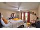 Cozy main bedroom with two windows for natural lighting, a ceiling fan, and a warm, inviting style at 53 Paine Dr, Winter Haven, FL 33884