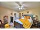 Relaxing main bedroom featuring a king bed, side tables, and charming décor at 53 Paine Dr, Winter Haven, FL 33884