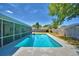 A refreshing backyard pool and screened-in lanai offer relaxing Florida outdoor living at 53 Paine Dr, Winter Haven, FL 33884