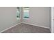 Neutral bedroom showcasing carpet and a large window, ready for personalization at 6784 Sw 90Th Loop, Ocala, FL 34476